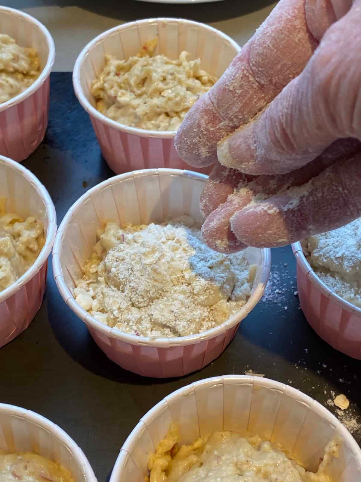 Before baking, sprinkle the top of the muffin batter with streusel topping. Before baking, sprinkle the top of the muffin batter with streusel topping.