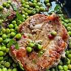 Pan fried pork steaks with chilli, mint & peas.