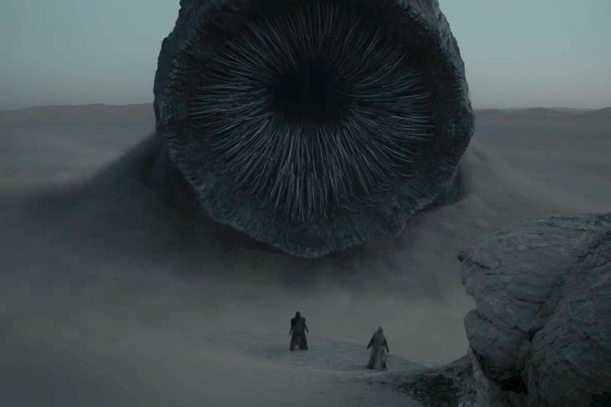 The sandworm from Dune 2020 popping out of Arakkis