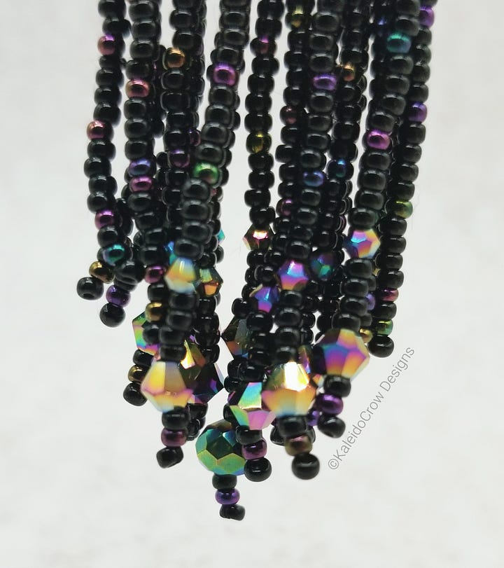 closeup photos of a beaded necklace made from black and rainbow/oil slick color shift beads