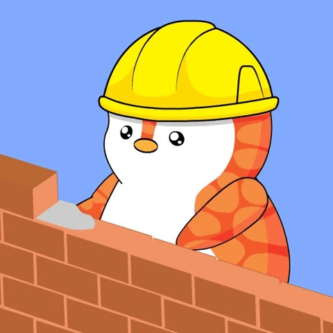 An orange penguin wearing a hardhat builds a brick wall. An orange penguin wearing a hardhat builds a brick wall.