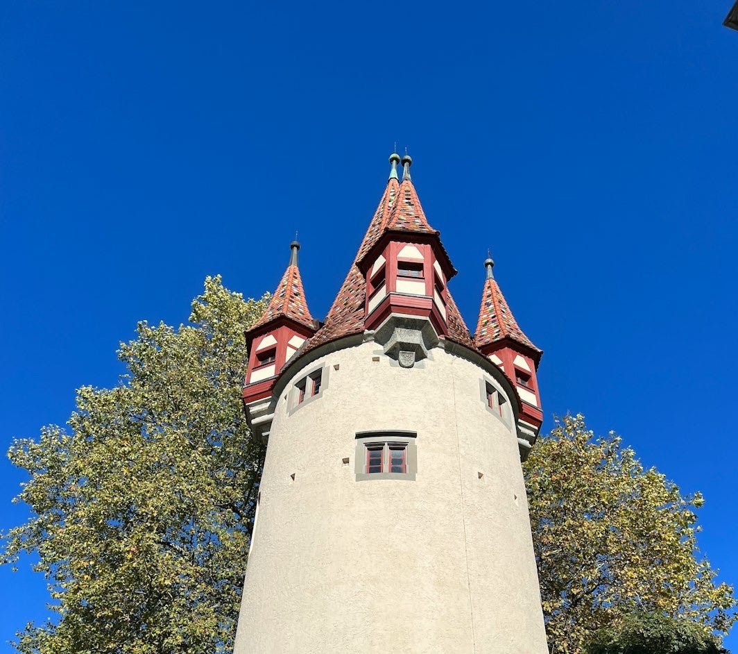 a tall tower with a clock on the top of it