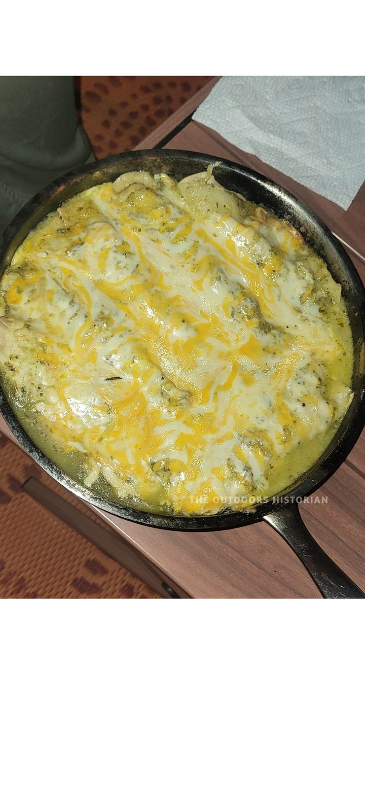 A four-photo sequence of campfire chicken enchiladas: raw ingredients on a picnic table, the assembled pan topped with shredded cheese, the bubbling finished dish, and a final serving on a plate.