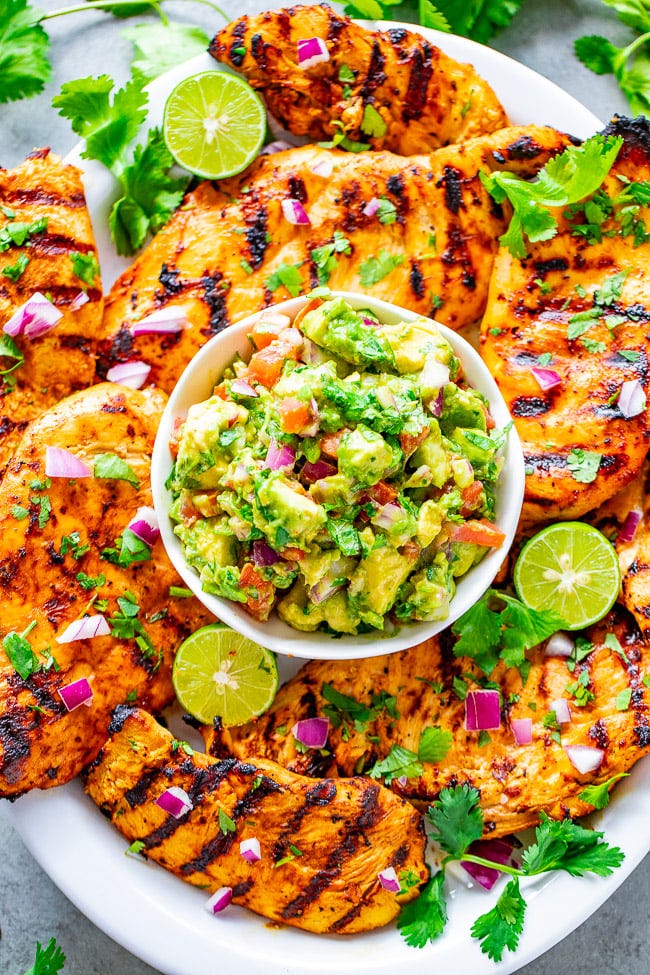 Grilled Cilantro Lime Chicken with Guacamole — EASY, ready minutes, and the chicken is tender, juicy, and full of Mexican-inspired flavors!! Chunky guacamole pairs PERFECTLY with this grilled chicken! A family favorite recipe everyone loves!! Grilled Cilantro Lime Chicken with Guacamole — EASY, ready minutes, and the chicken is tender, juicy, and full of Mexican-inspired flavors!! Chunky guacamole pairs PERFECTLY with this grilled chicken! A family favorite recipe everyone loves!!
