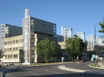 A building with trees around it

AI-generated content may be incorrect.