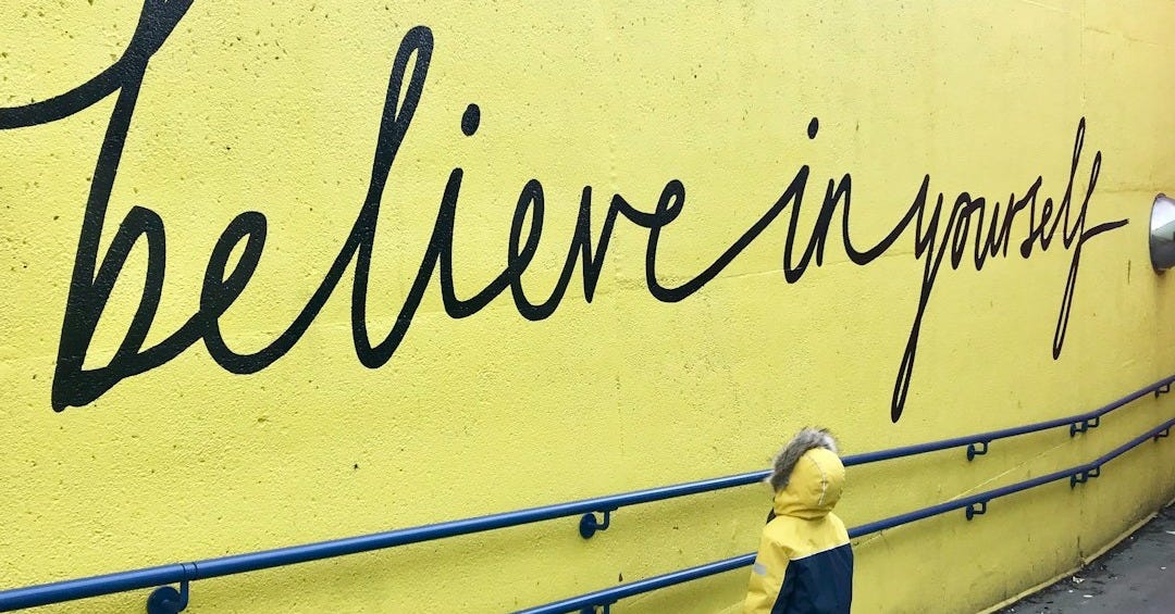 toddler looking at believe in yourself graffiti toddler looking at believe in yourself graffiti