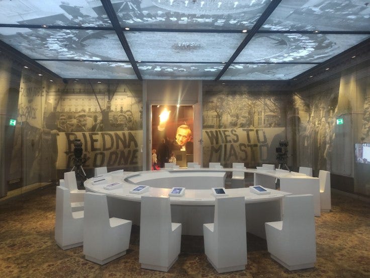 A round table recreates the feel of union organisers debating with authorities