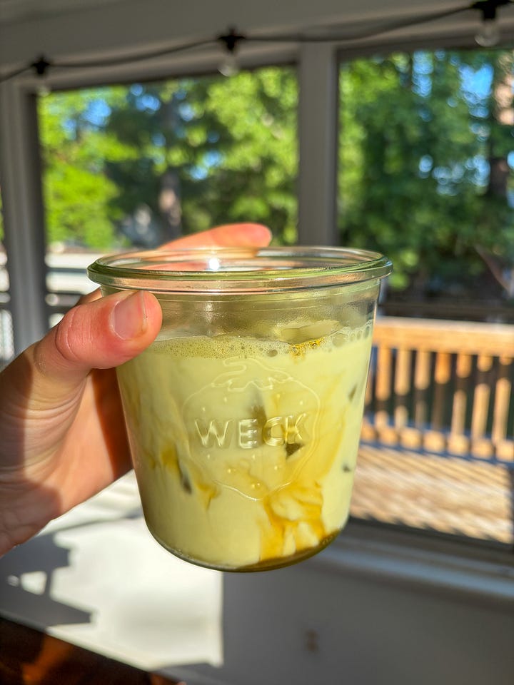 Iced salted honey collagen matcha latte and a coconut-cashew yogurt bowl with frozen blueberries, almond butter, and bee pollen