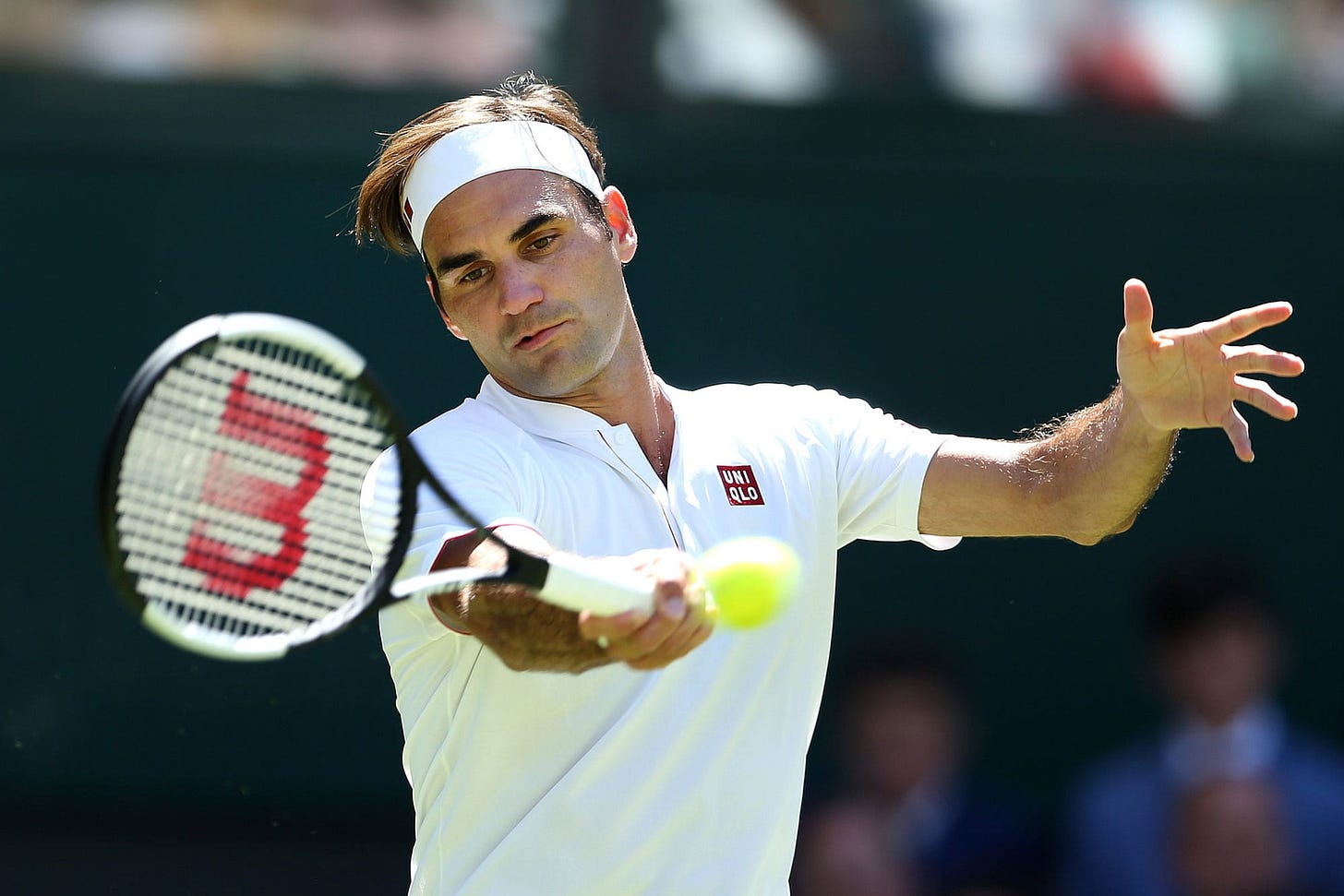 Roger Federer walks out at Wimbledon in Uniqlo shirt, not Nike