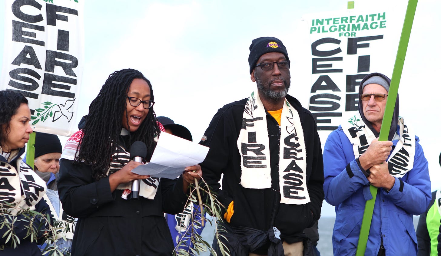 Kamal stands with others at an Interfaith Pilgrimage for Ceasefire and Palestinian liberation.