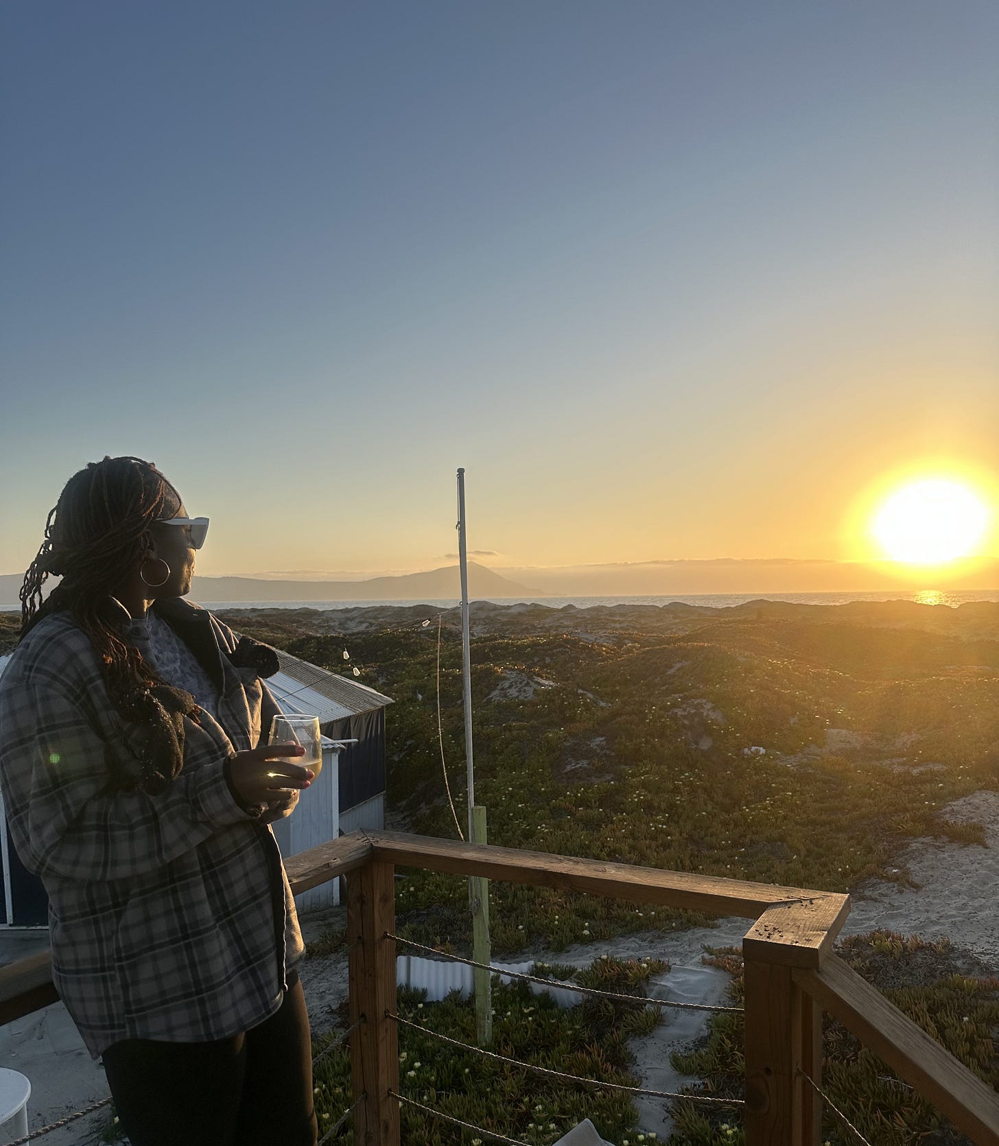 woman looking into sunset