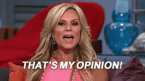 This may contain: a woman in a pink dress is talking to someone on the television set that says, that's my opinion