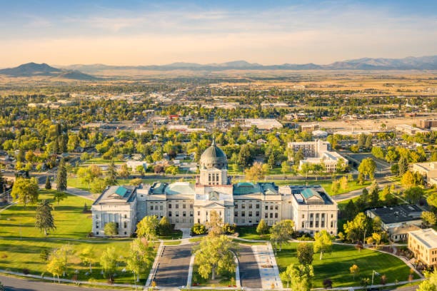 Montana State Capitol, in Helena, on a sunny and hazy afternoon. Drone view of the Montana State Capitol, in Helena, on a sunny afternoon with hazy sky caused by wildfires. The Montana State Capitol houses the Montana State Legislature. montana state capitol stock pictures, royalty-free photos & images