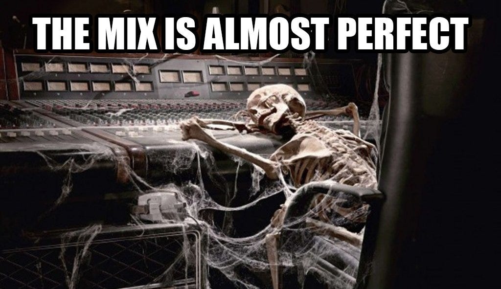 A skeleton covered in cobwebs collapsed on a mixing desk with the caption 'the mix is almost perfect'