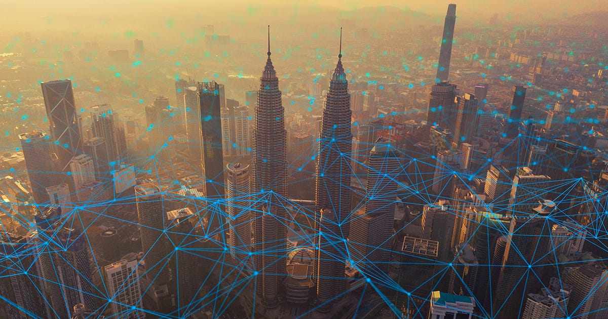 City skyline overlaid with digital network lines, symbolizing civilian infrastructure as a digital battlefield in modern strategic competition. City skyline overlaid with digital network lines, symbolizing civilian infrastructure as a digital battlefield in modern strategic competition.