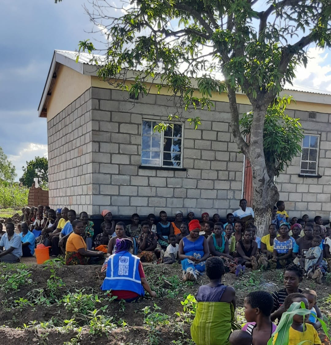 May be an image of 1 person, standing, tree, outdoors and text that says 'UN HN DP' May be an image of 1 person, standing, tree, outdoors and text that says 'UN HN DP'