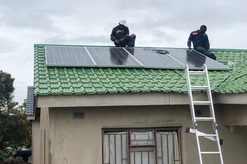 Zonful Energy staff installing solar panels in Zimbabwe. Zonful Energy staff installing solar panels in Zimbabwe.