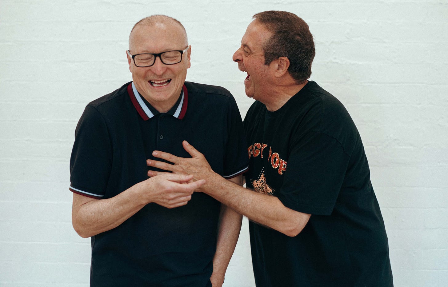 Ed Edwards and Mark Thomas, both laughing their arses off.