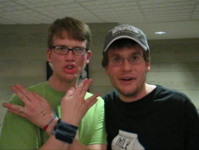 John and Hank Green throwing up the nerdfighteria sign.