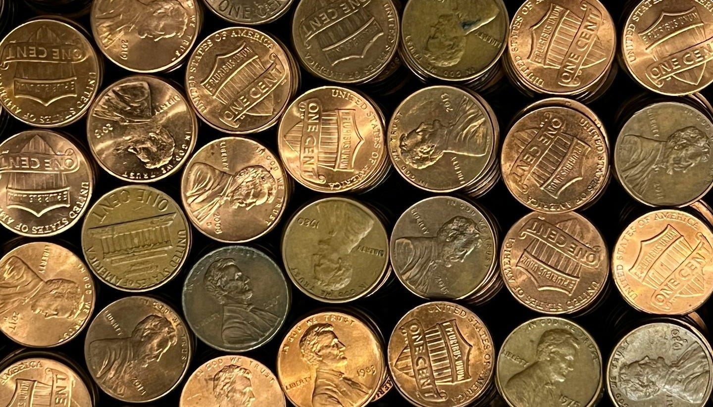 a pile of different types of coins