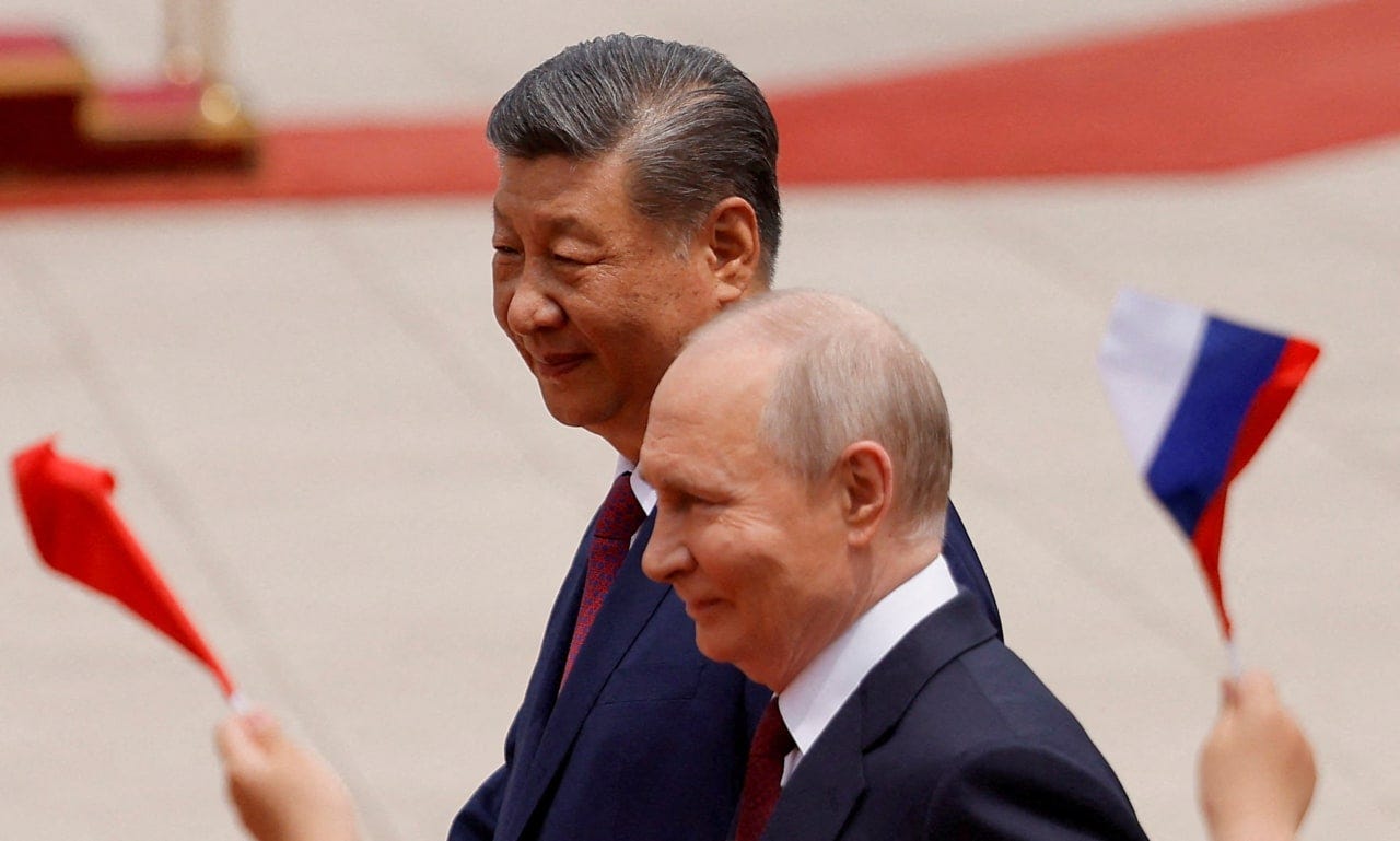 Russian President Vladimir Putin and Chinese President Xi Jinping attend a welcoming ceremony at the Great Hall of the People in May. 