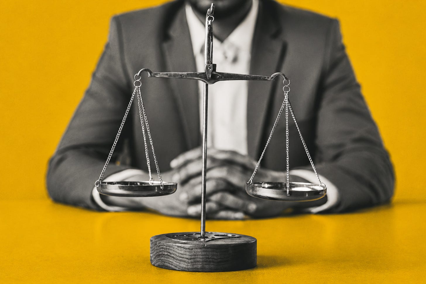 Scales of justice sit in sharp focus against a bold yellow backdrop, reflecting the growing scrutiny around trust, fraud, and accountability in Jamaica’s real estate sector. Jamaica Homes. Scales of justice sit in sharp focus against a bold yellow backdrop, reflecting the growing scrutiny around trust, fraud, and accountability in Jamaica’s real estate sector. Jamaica Homes.