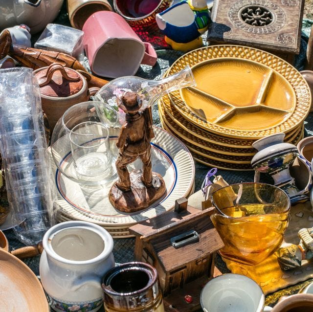 This may contain: a table topped with lots of different types of plates and bowls next to each other