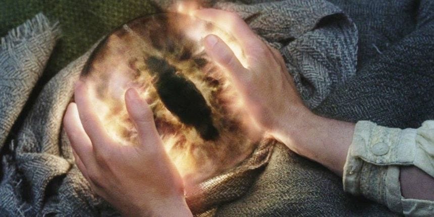 Pippin's hands on the Palantir in The Lord of the Rings