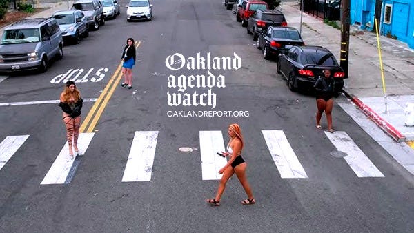 Women crossing the street on International Boulevard. Oakland, California. (Image source: Street Clipz / YouTube). Women crossing the street on International Boulevard. Oakland, California. (Image source: Street Clipz / YouTube).