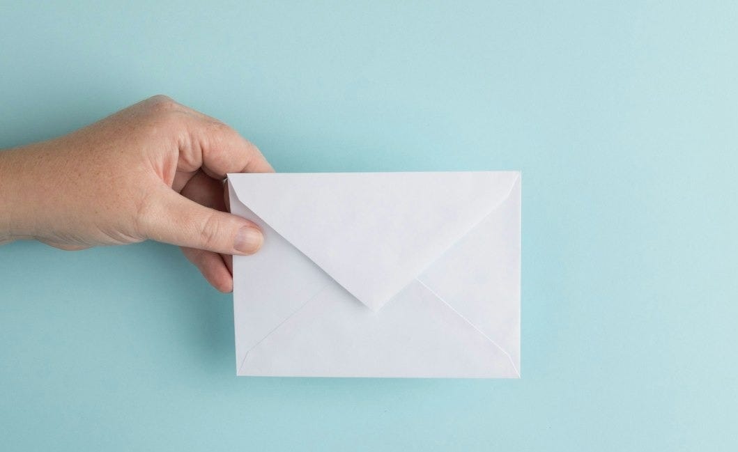 person showing white envelope person showing white envelope