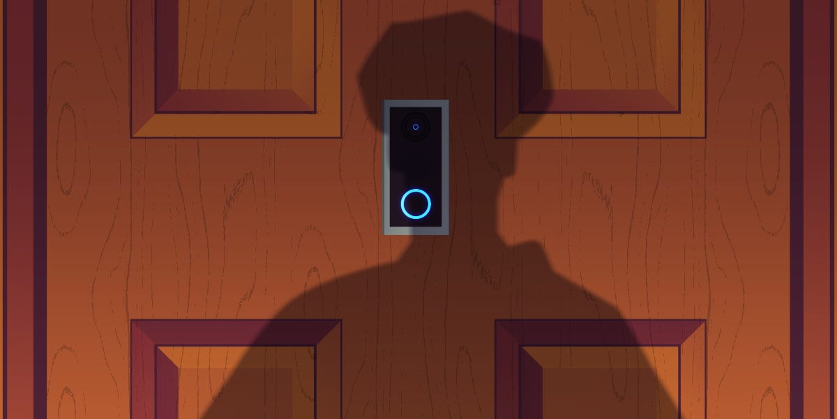 The shadow of a police officer looms in front of a Ring device on a closed door. The shadow of a police officer looms in front of a Ring device on a closed door.