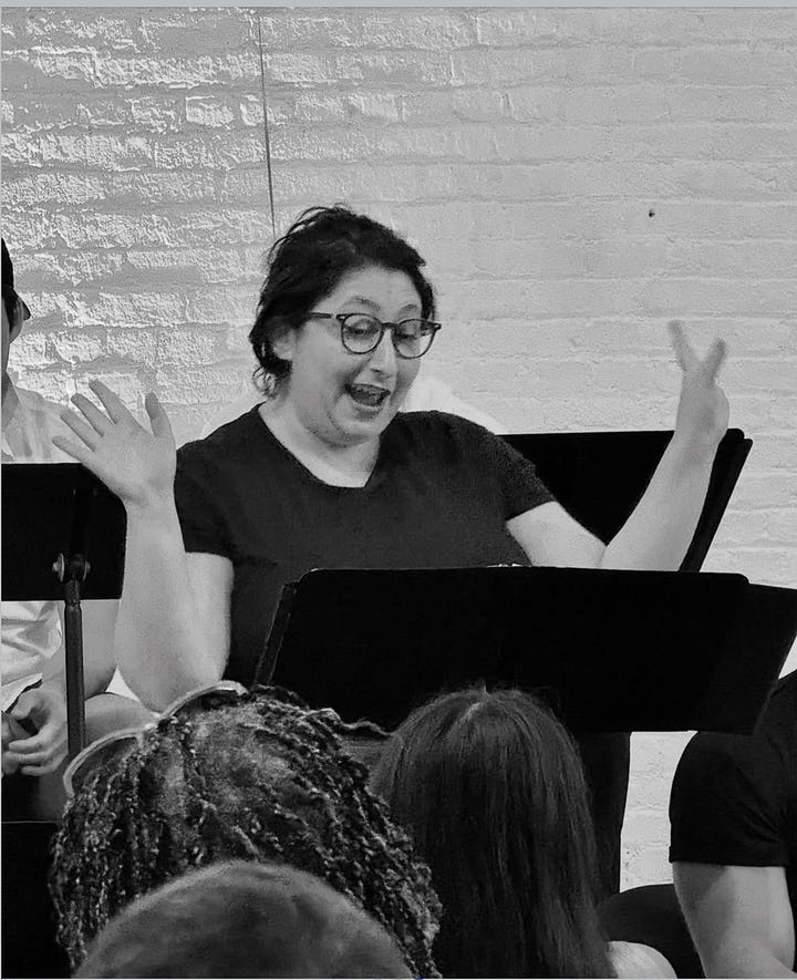Left: Poster for "Someone Should Start" play reading with a blue robe hanging off a stool. Right: Actor Maggie Metnick wearing glasses during the reading.