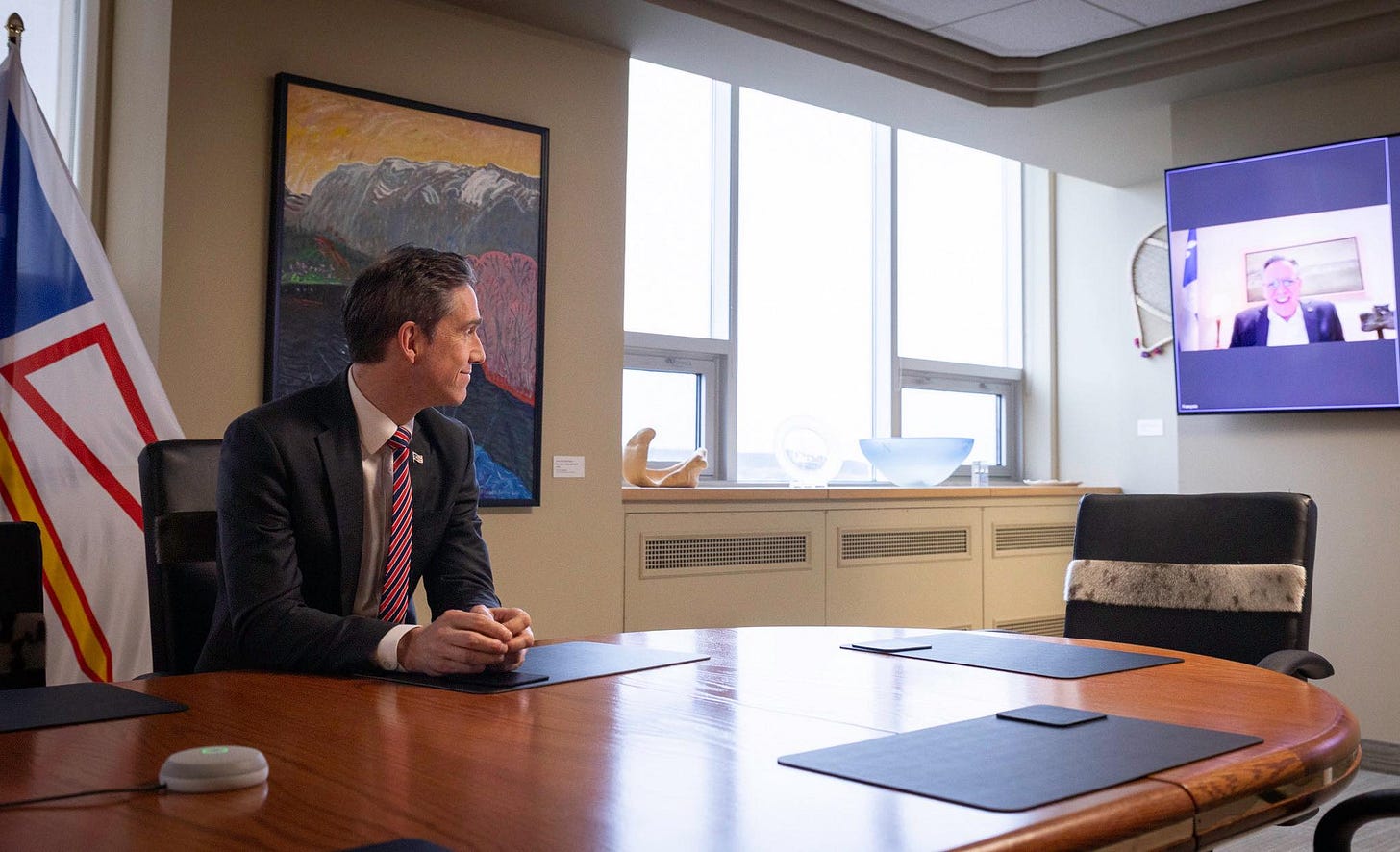 May be an image of 2 people and newsroom