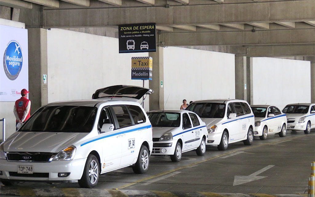 Official taxis waiting in front of the airport in Medellin