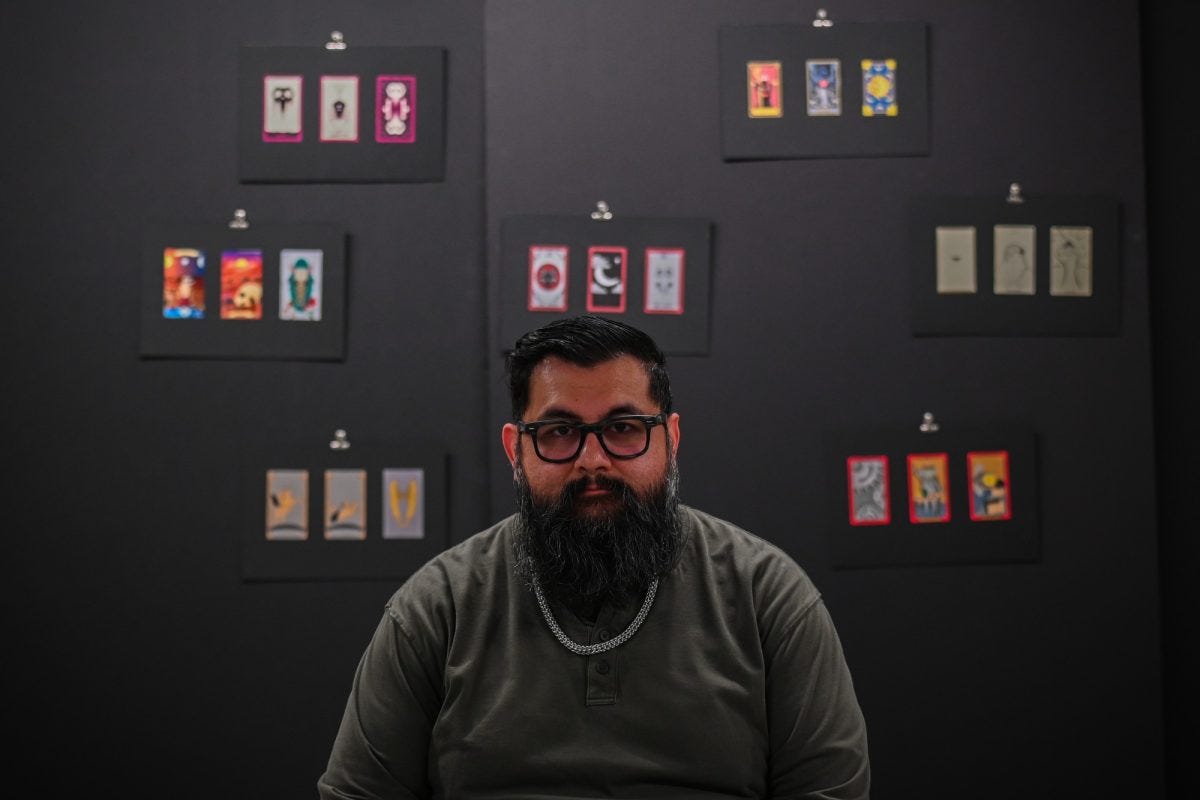 El Camino College Fine Arts instructor Robert Lacki, displays his student-designed tarot cards in the El Camino College art complex on Thursday, April 10, 2025. (Bret Fast | Warrior Life) El Camino College Fine Arts instructor Robert Lacki, displays his student-designed tarot cards in the El Camino College art complex on Thursday, April 10, 2025. (Bret Fast | Warrior Life)