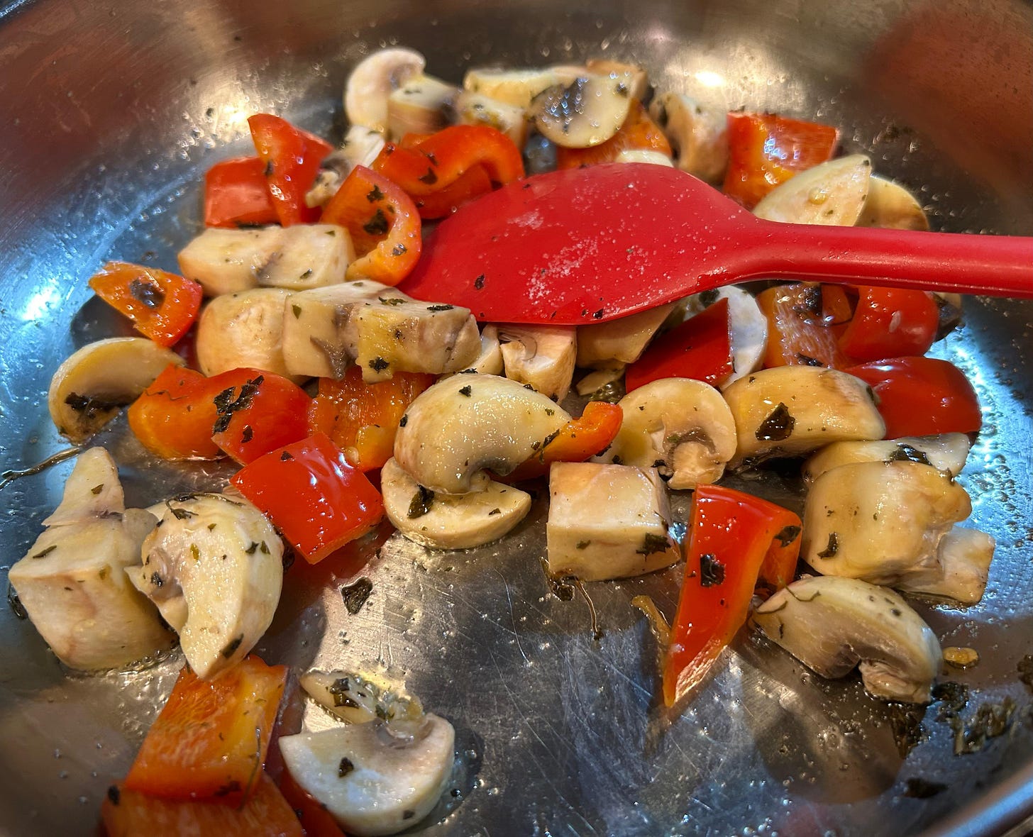 Mushrooms and red bell peppers cooking for Makhani sauce