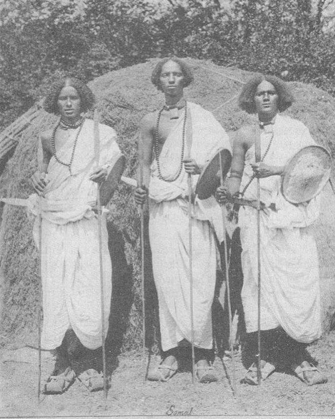 This may contain: three women standing next to each other holding tennis racquets