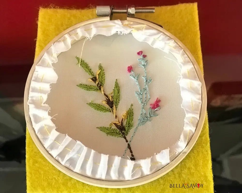 back of an unfinished hoop sitting on yellow felt