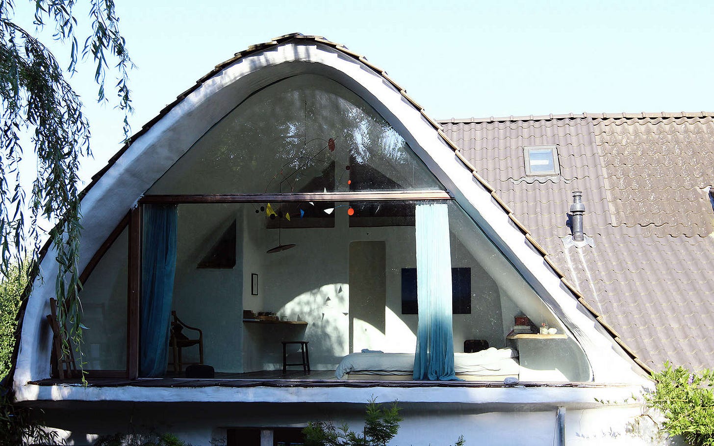 the glass wall is divided into three sections, with the outer framing hidden wi 18