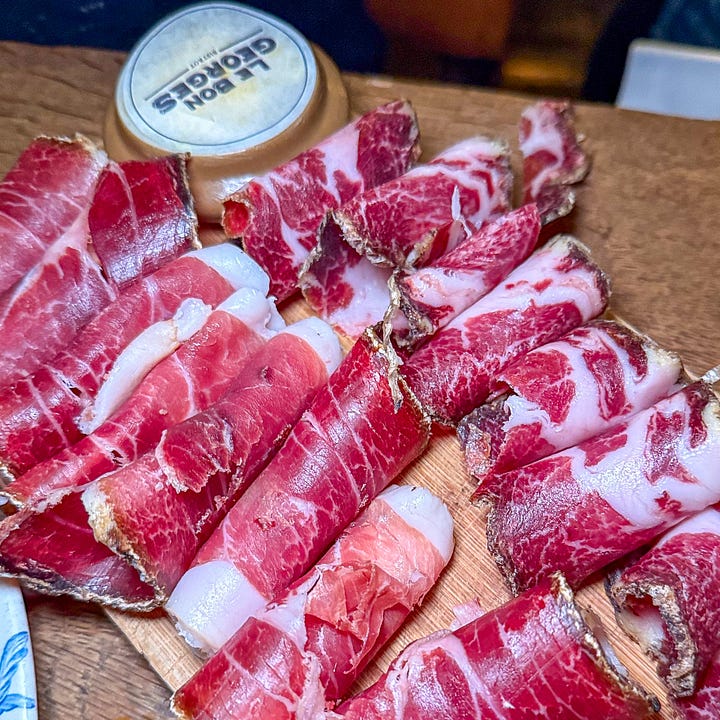 Starters at Le Bon Georges in Paris - oeufs mayo, pate en croute, seafood vol-au-vent, and Corsican charcuterie