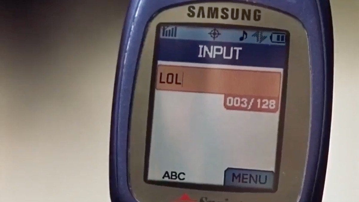 Still from A Cinderella Story that shows Sam's flip phone with "LOL" typed into a text message box Still from A Cinderella Story that shows Sam's flip phone with "LOL" typed into a text message box