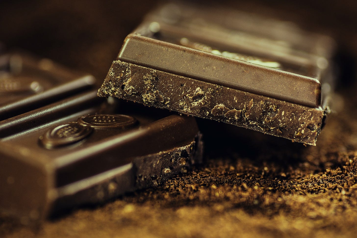 Close up of squares of dark chocolate Close up of squares of dark chocolate