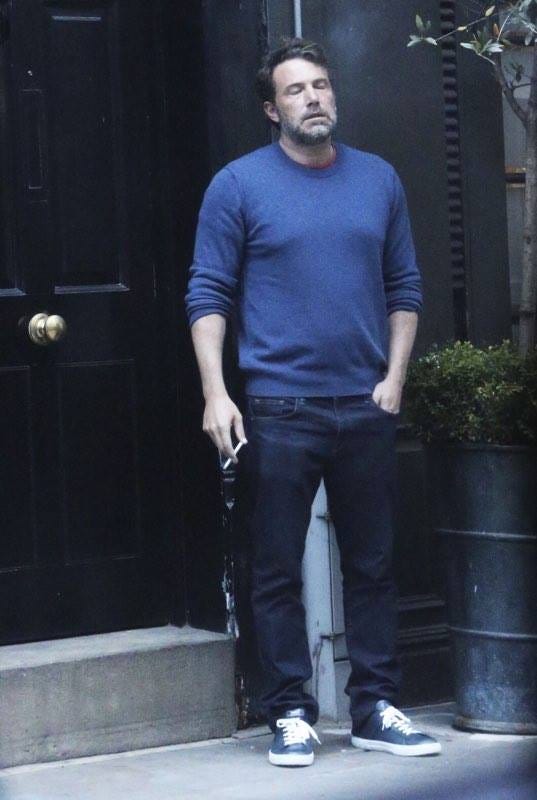Ben Affleck looking exhausted and contemplative while walking outside. Caption: First-time founders when they're not faking toxic positivity on LinkedIn