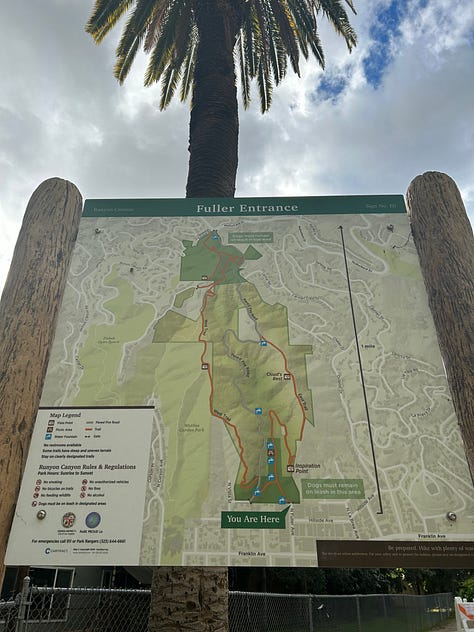 the map of the trails, views from the trails, including the locks on a fence line and the paved path down, and Hannah smiling with the Hollywood sign - pretty far behind her