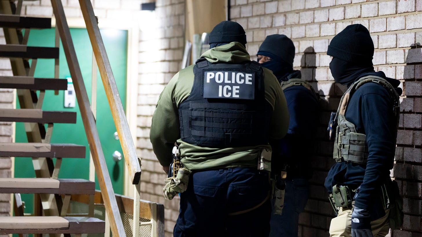 U.S. Immigration and Customs Enforcement officers wait to detain a person, Jan. 27, 2025, in Silver Spring, Md.