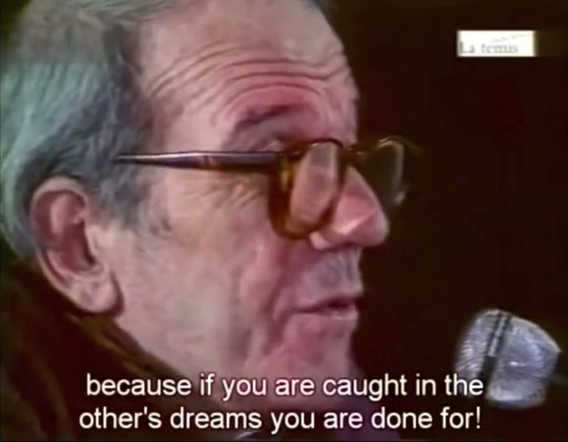 An older white man with thick rimmed glasses--Gilles Deleuze--is speaking into a microphone and there is a caption that reads Because if you are caught in the other's dreams you are done for! An older white man with thick rimmed glasses--Gilles Deleuze--is speaking into a microphone and there is a caption that reads Because if you are caught in the other's dreams you are done for!