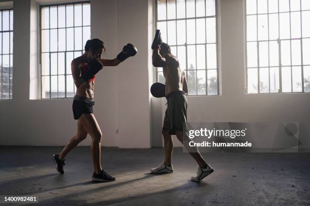 Two Athletic Sparring Partners Practice Boxing In A Gym Working On Their  Technique And Physical Fitness Under The Morning Light High-Res Stock Photo  - Getty Images