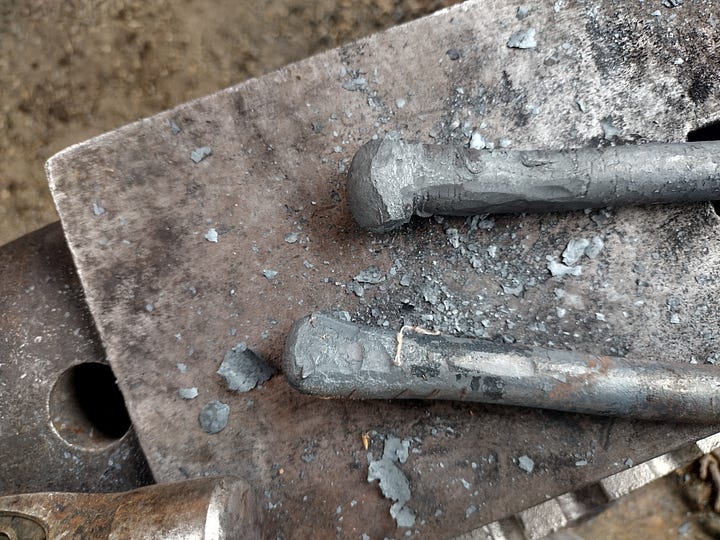 The straightened spring, and the two finished fullers.