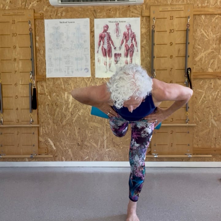 four photos of a woman standing on one leg with either a foam roller or mat as a prop