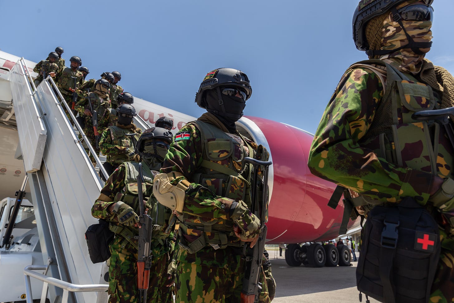 A contingent of Kenyan police officers arriving in Port-au-Prince in July to dismantle armed criminal gangs operating in Haiti. (Photo by Guerinault Louis/Anadolu via Getty Images.)